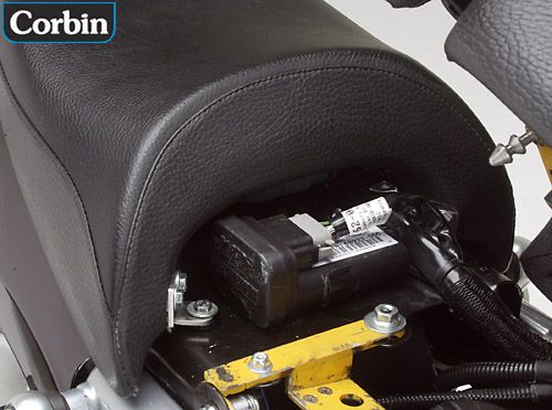 rear seat's tongue shown slipped under the mounting tabs and secured with two bolts